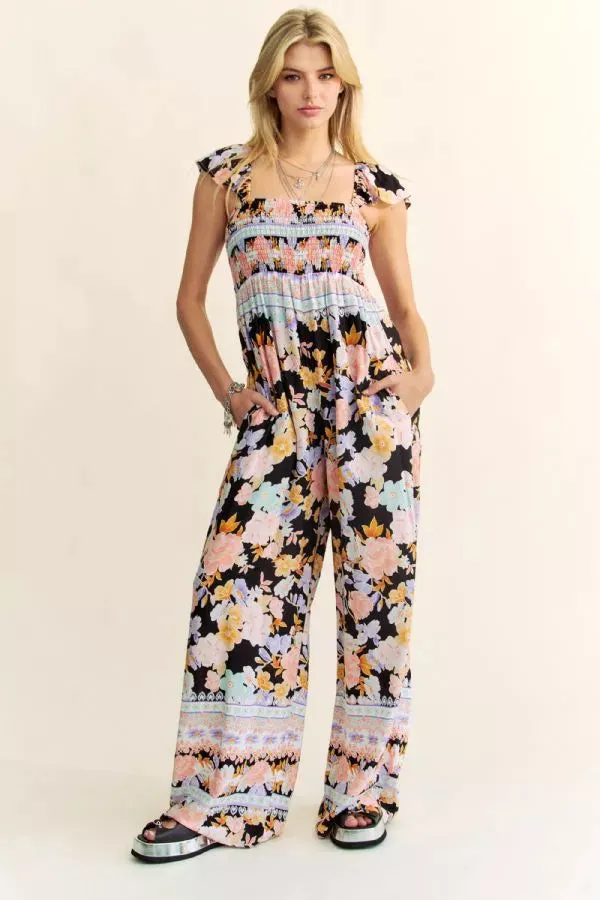 FLORAL BORDER SMOCKED BODICE RUFFLED JUMPSUIT