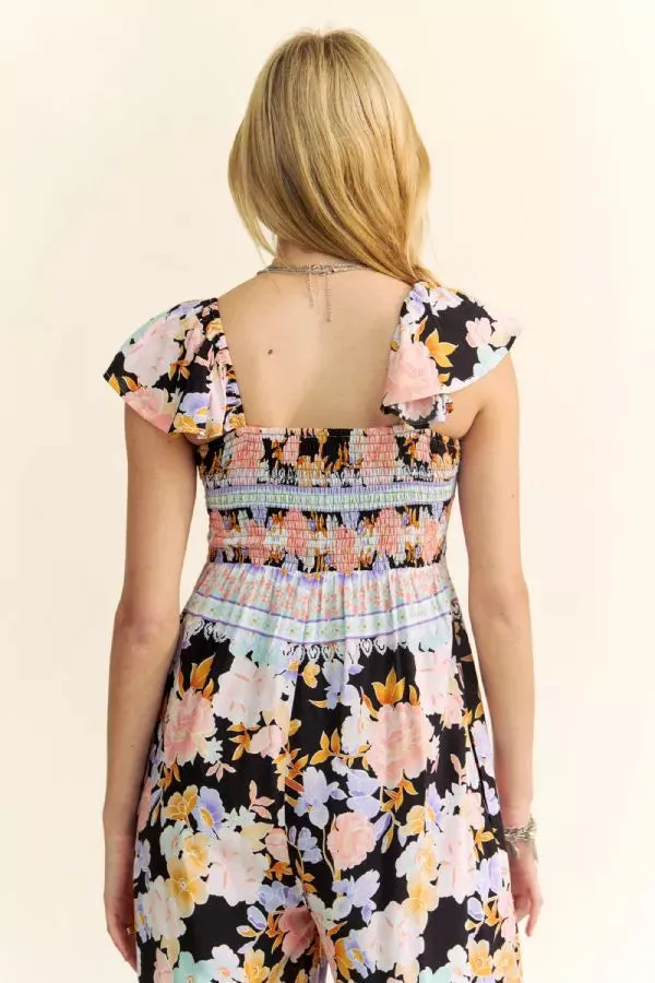 FLORAL BORDER SMOCKED BODICE RUFFLED JUMPSUIT