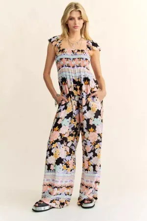 FLORAL BORDER SMOCKED BODICE RUFFLED JUMPSUIT